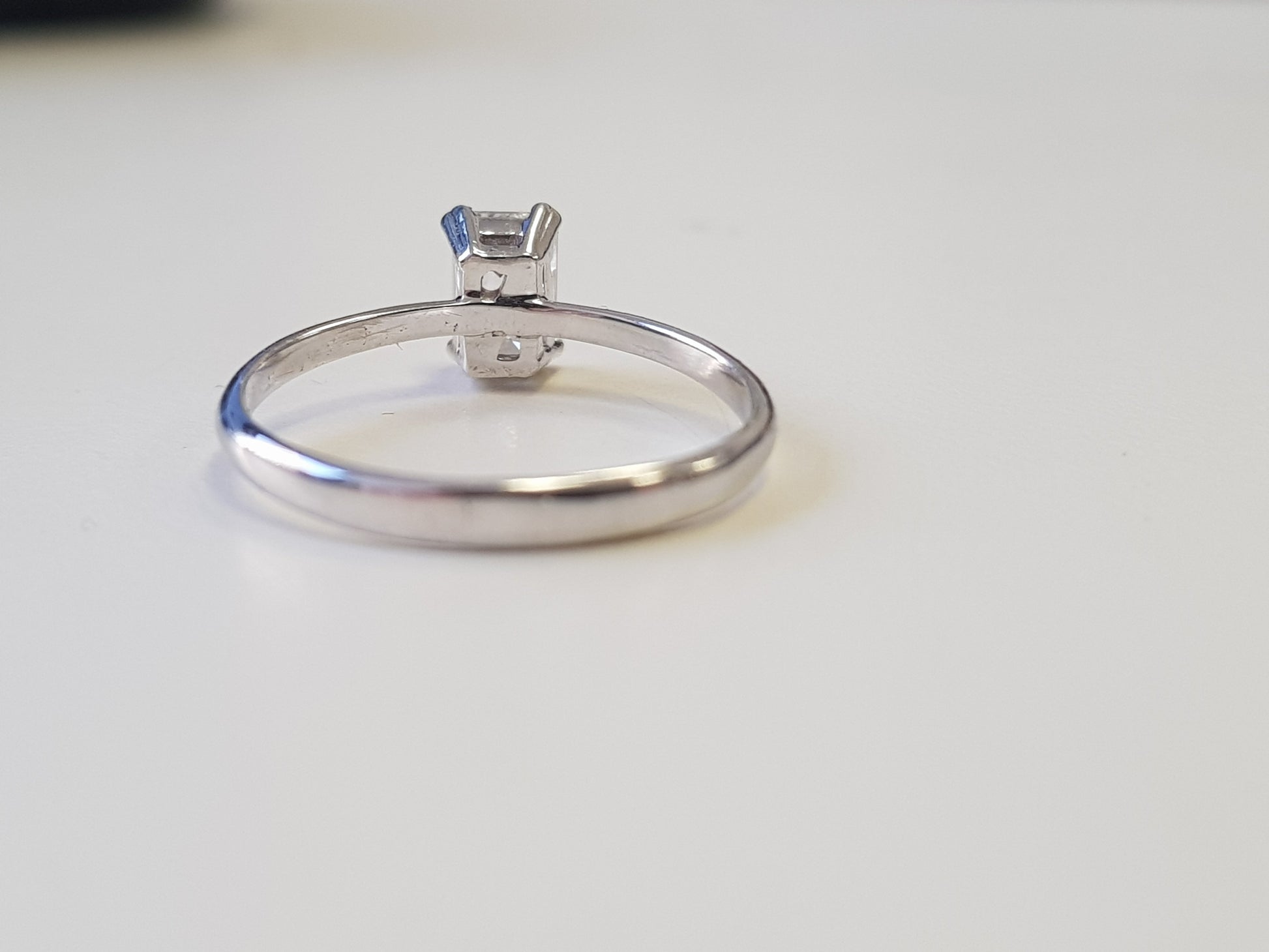 emerald cut diamond solitaire ring back view